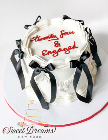 Vintage engagement cake with black bows NYC Custom Cakes Long Island Buttercream Cakes